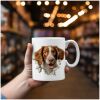 magicdatnl2023_Brittany_Spaniel_Dog_walking_through_a_hole_in_t_c167b1eb-2279-46fc-a26d-1b6de18447e5-Smart Object-339-Suffix hand